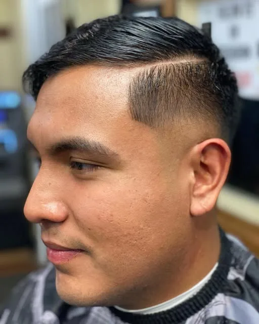 Classic side part with a hard line and tapered sides