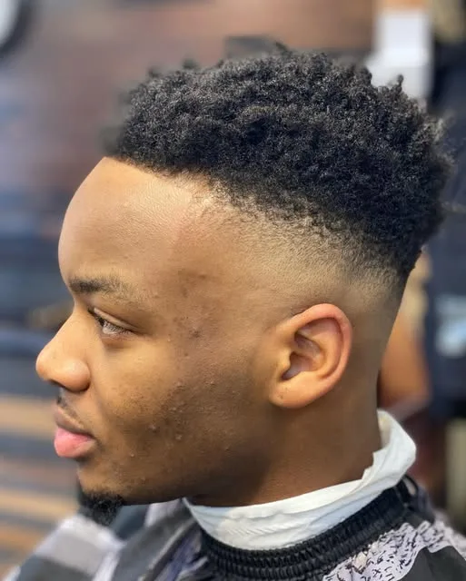 High-top fade with a crisp line-up, side profile